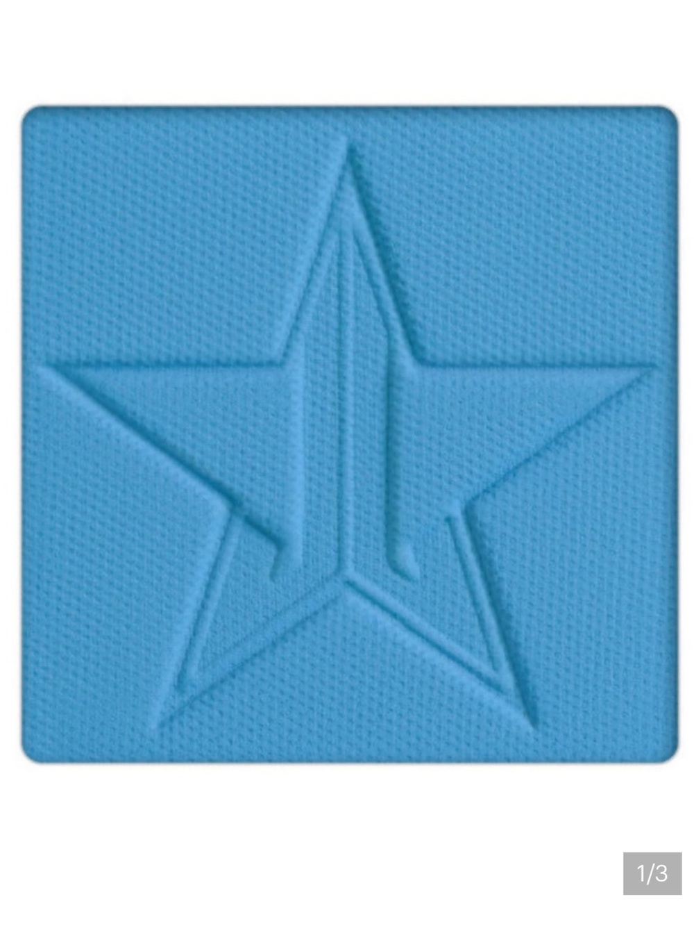 Jeffree Star Grand Prismatic Eyeshadow in Pink Packaging with Bright Blue Shade